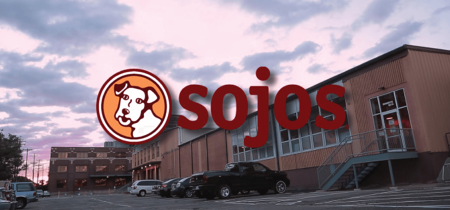 Sojos Pet Food logo in front of the business building