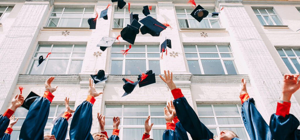 College Graduates Throwing Caps in the Air