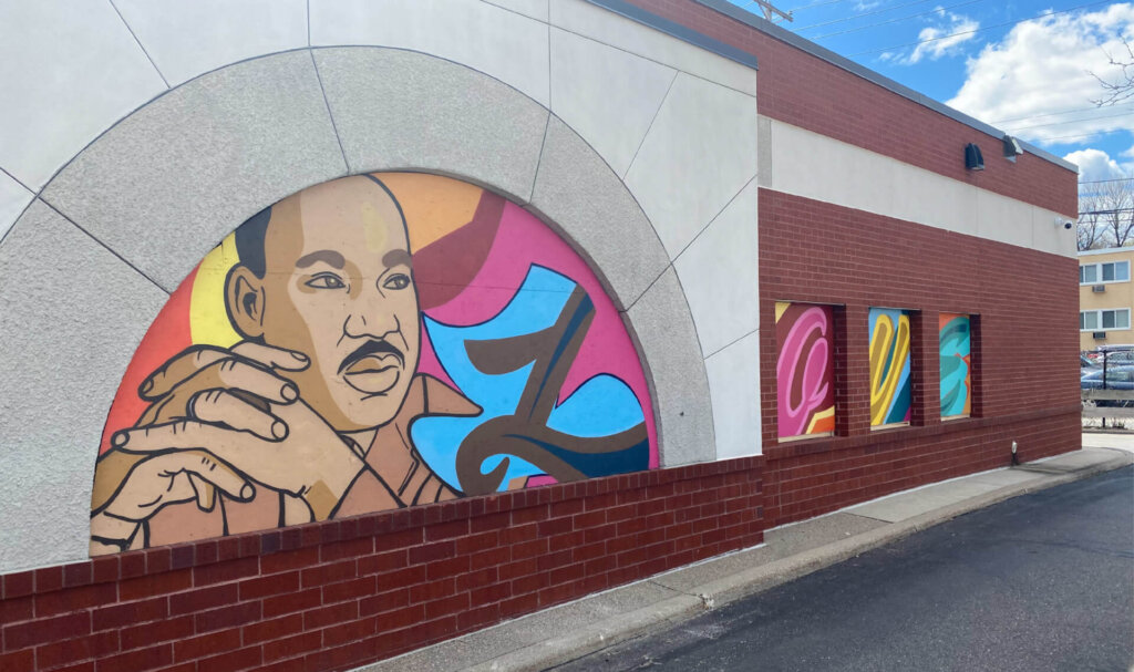 A photo of a mural of Martin Luther King Jr. on a Sunrise Banks branch.