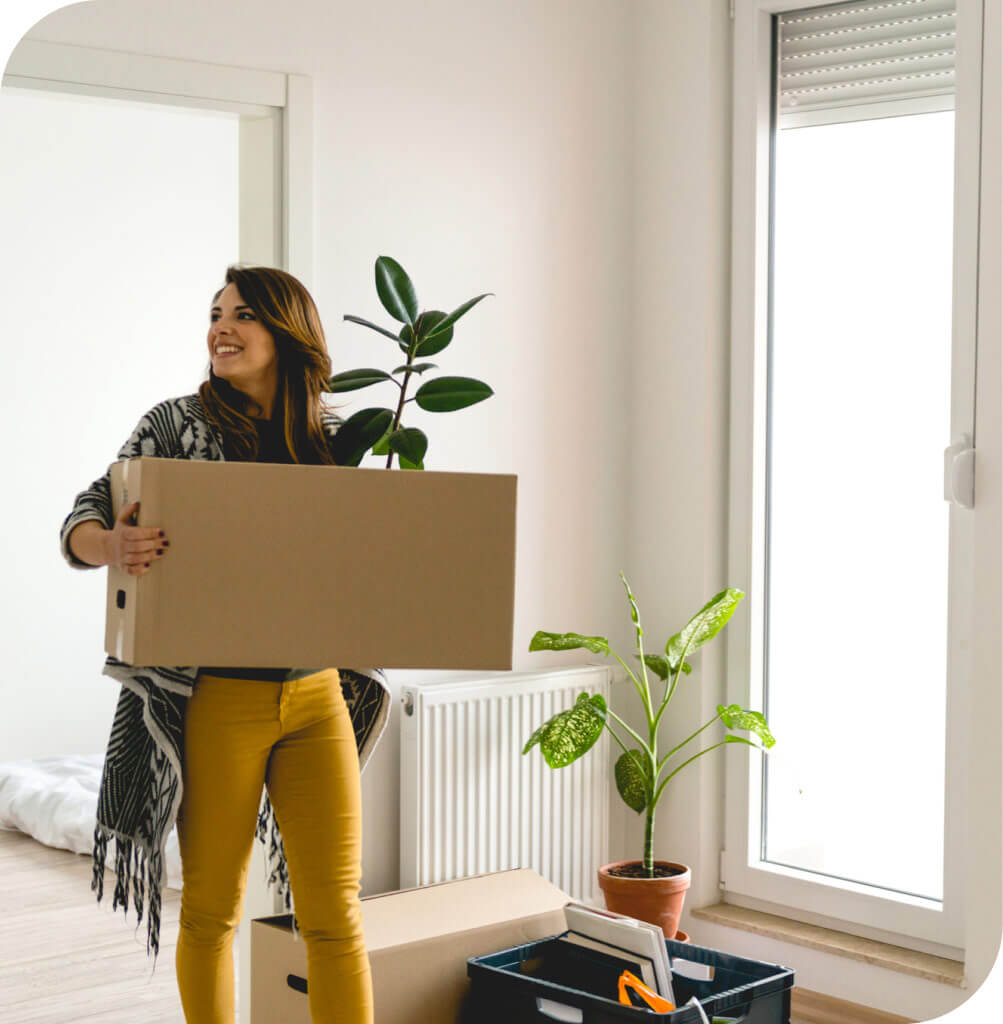happy woman moving into new apartment