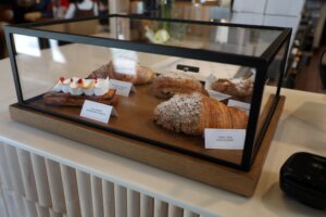 A glass case holding a variety of pastries.