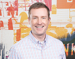 A headshot of Andrew Toftey