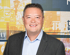 A headshot of David Scott