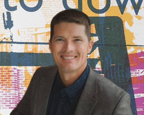A headshot of Damon Sehr