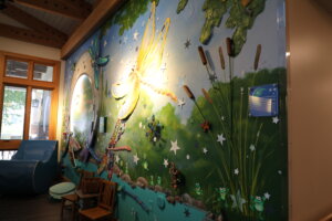 A garden-inspired mural on the wall at Crescent Cove.