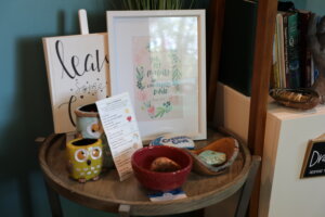 A collection of picture frames and items on a table.