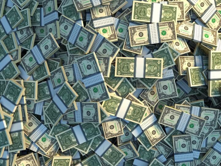 a large pile of strapped one dollar hills