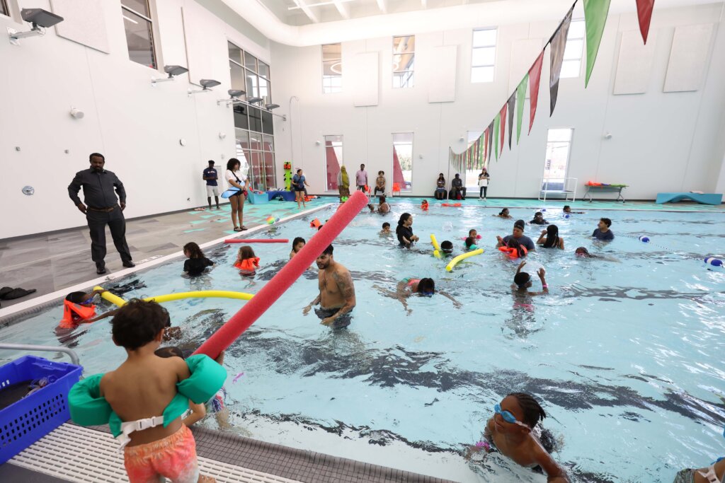 People swimming in the pool at V3 Sports.