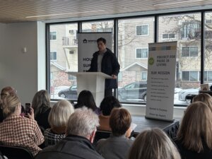 Minneapolis Mayor Jacob Frey speaks to attendees of a community open house at the new Simpson Housing Community Shelter and Apartments