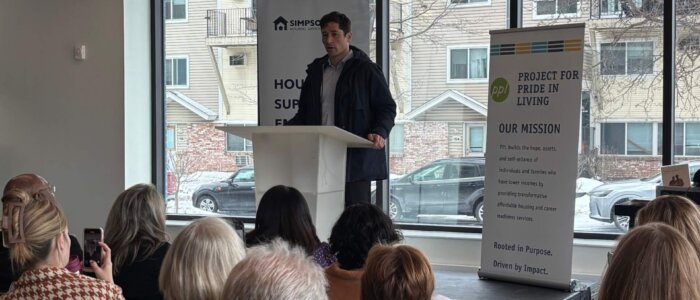Minneapolis Mayor Jacob Frey speaks to attendees of a community open house at the new Simpson Housing Community Shelter and Apartments
