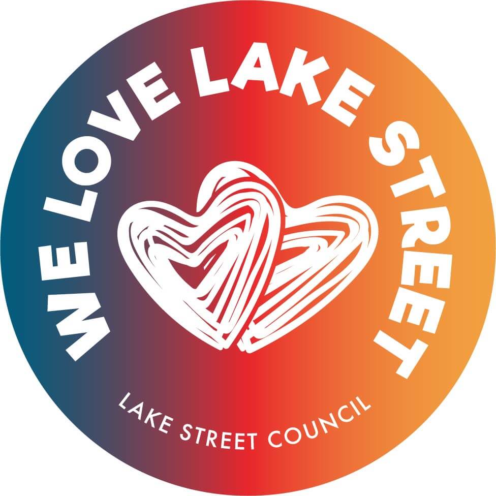 Logo for the "We Love Lake Street" campaign - colorful circle with two hand-drawn hearts.