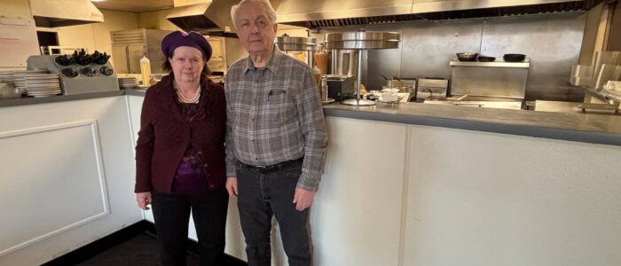 Carol and Gus Parpas, Christos Restaurant owners, stand in front of the kitchen.