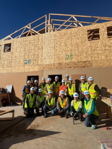 Volunteers building a Habitat for Humanity house.