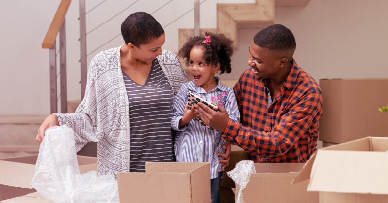 A family unpacks in their new home