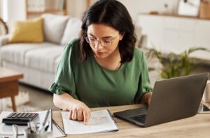 A woman reviewing her finances and budget.