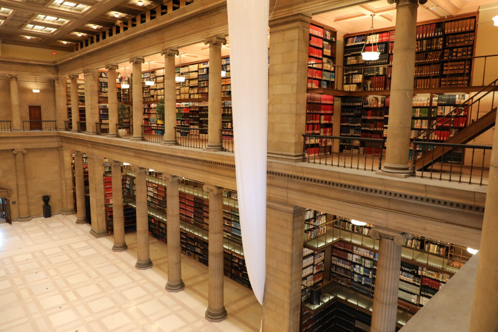 A wall of library books inside the former James J. Hill Reference Library.